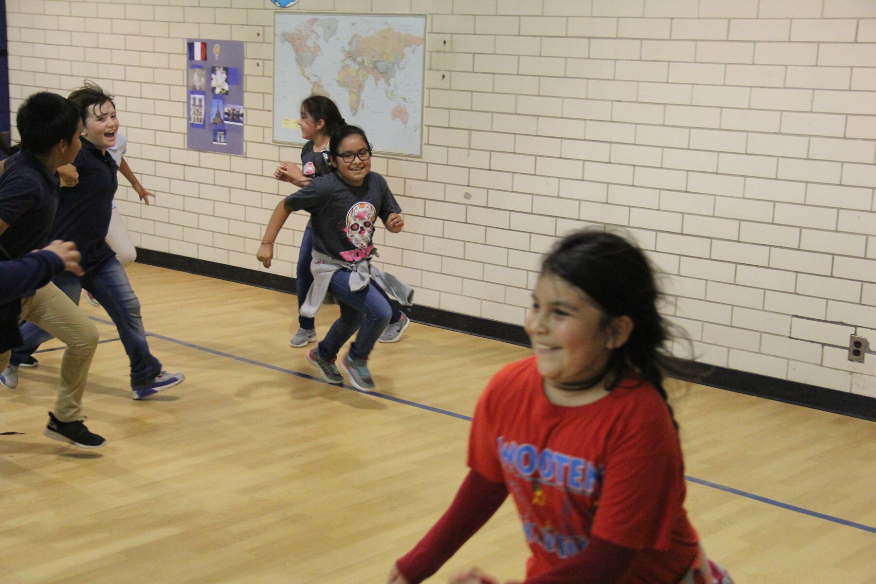 Group of children playing a game during the Stronger Austin Kids out-of-school-time enrichment program